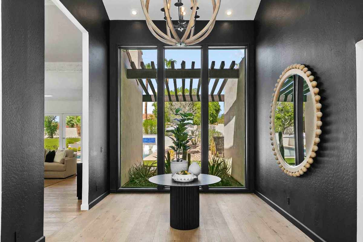 Bright entryway with black walls