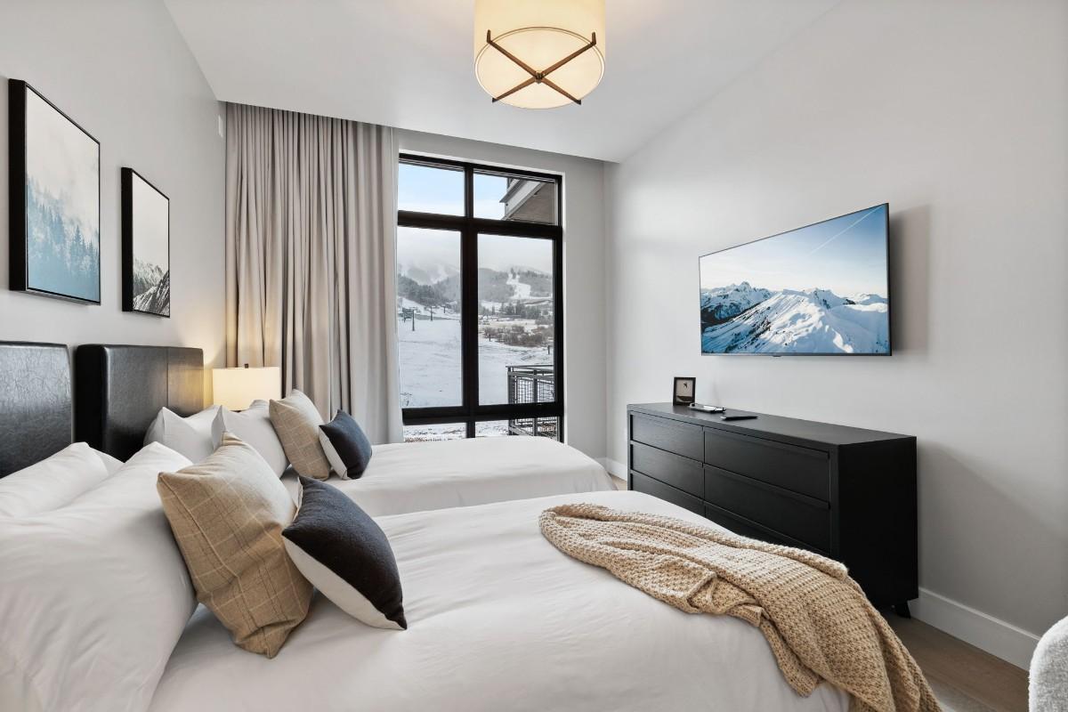 A cozy modern bedroom with two neatly made beds